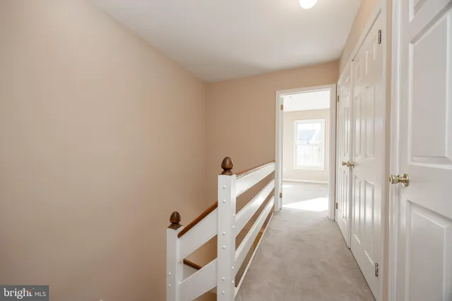 a view of a hallway with a white walls