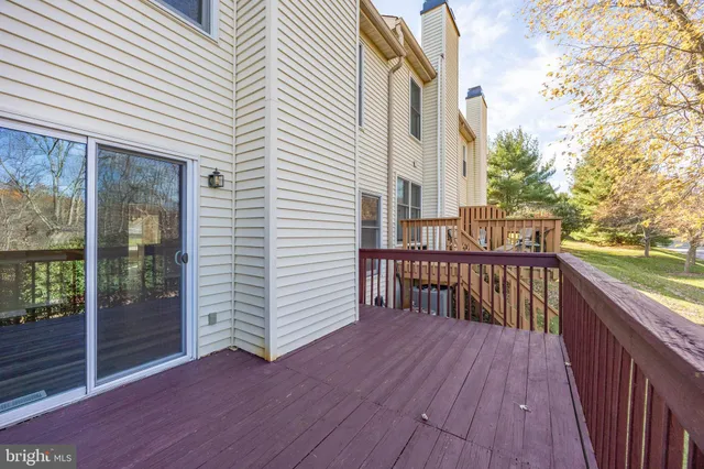 a view of balcony with wooden floor