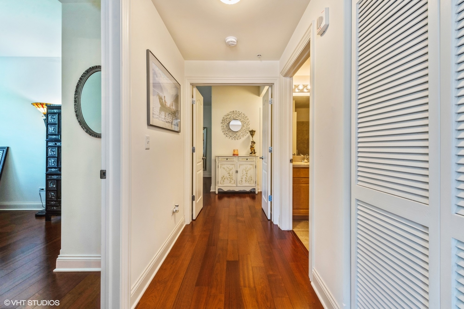 1 Itasca Road, Unit 101 Itasca, IL 60143 - Photo 13 of 21 a view of a hallway with wooden floor and staircase