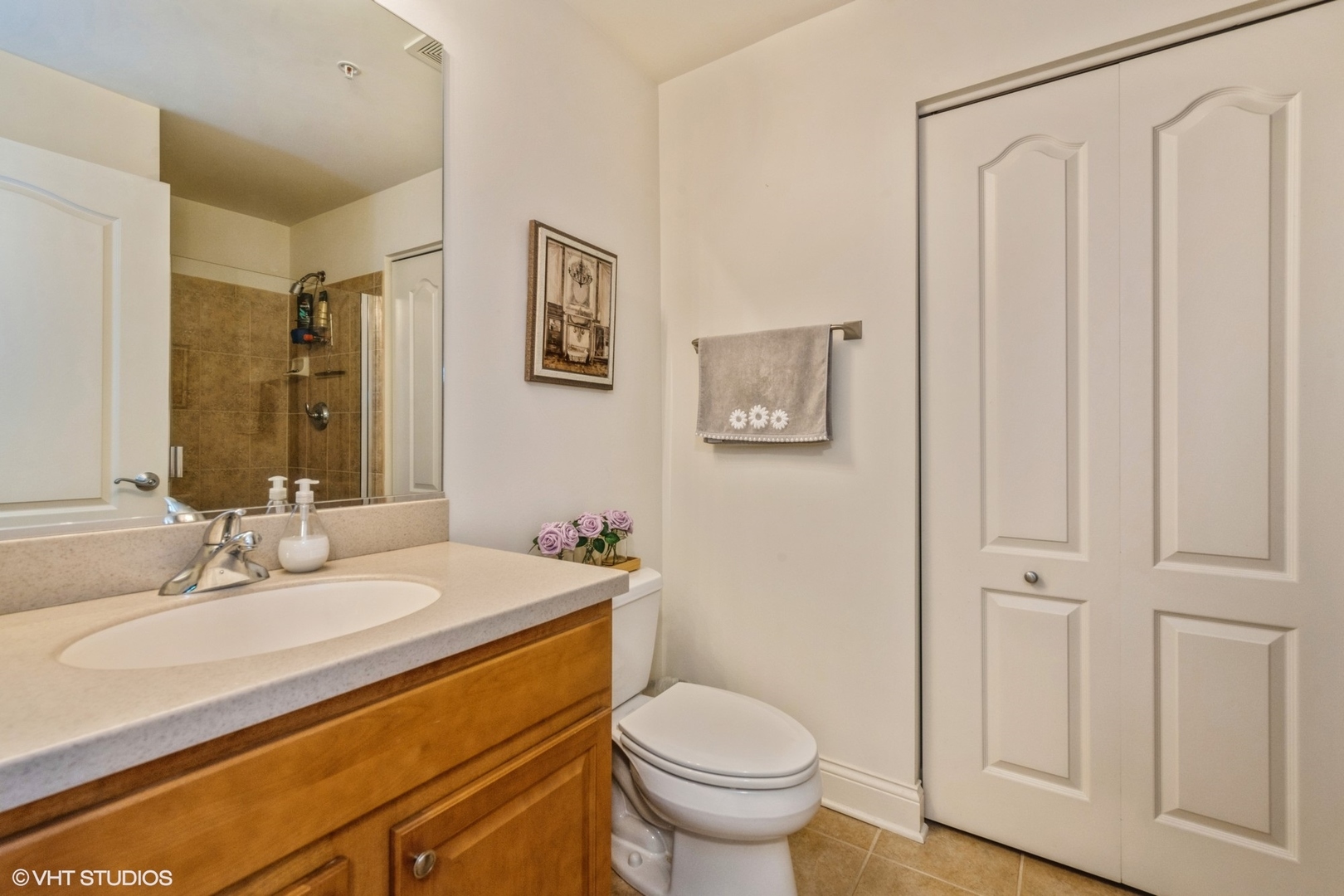 1 Itasca Road, Unit 101 Itasca, IL 60143 - Photo 17 of 21 a bathroom with a sink toilet and shower