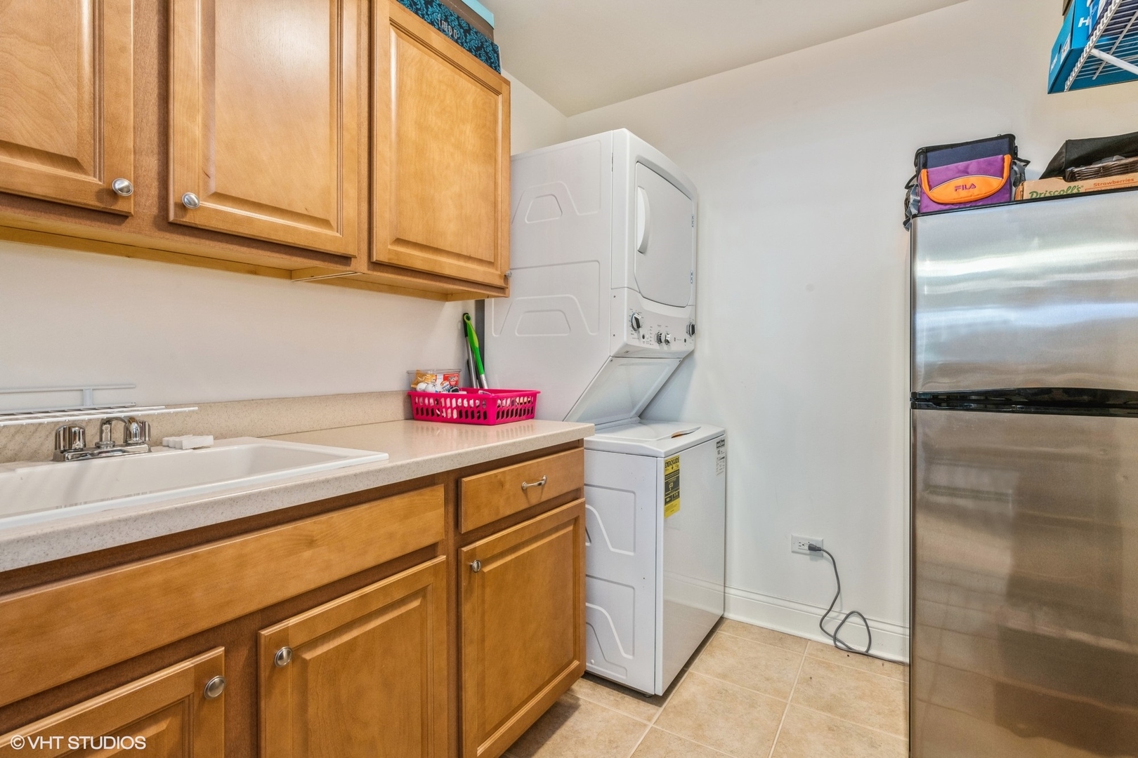 1 Itasca Road, Unit 101 Itasca, IL 60143 - Photo 18 of 21 a utility room with cabinets washer and dryer