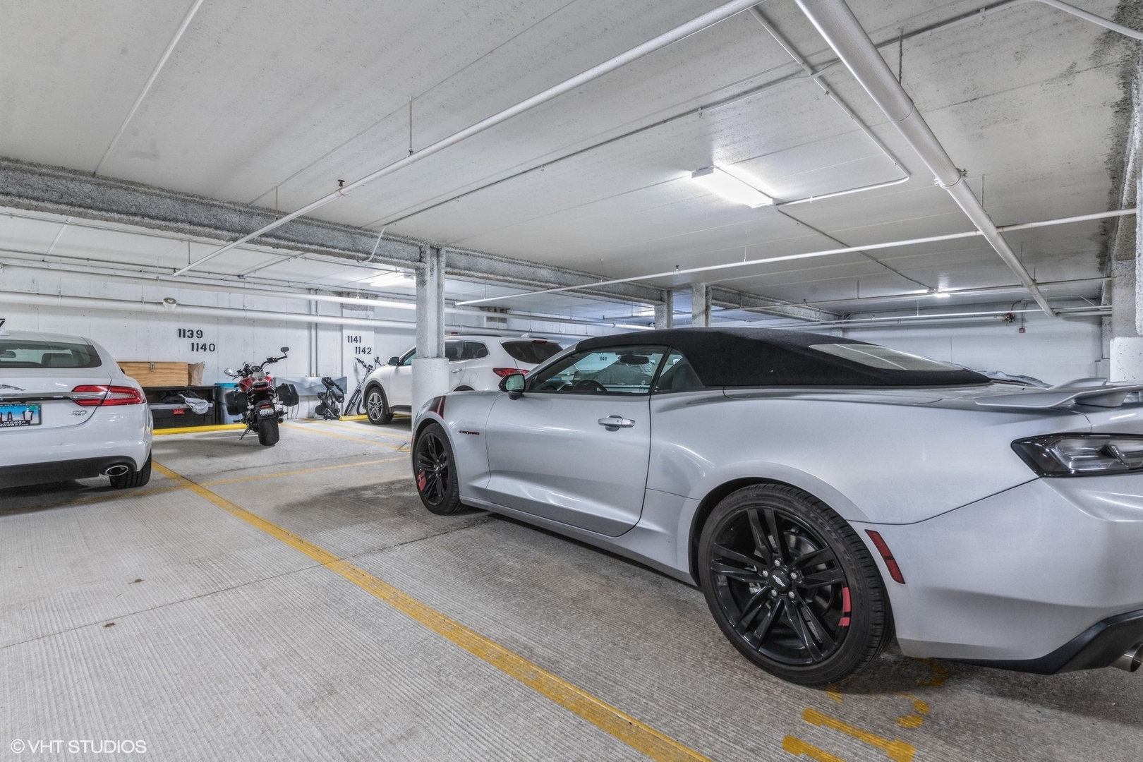 1 Itasca Road, Unit 101 Itasca, IL 60143 - Photo 21 of 21 a view of parking garage with cars parked