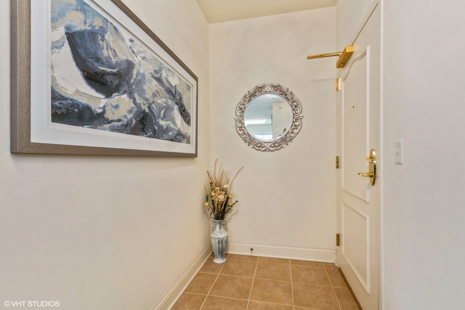 1 Itasca Road, Unit 101 Itasca, IL 60143 - Photo 3 of 21 a view of a hallway with wooden floor and a window