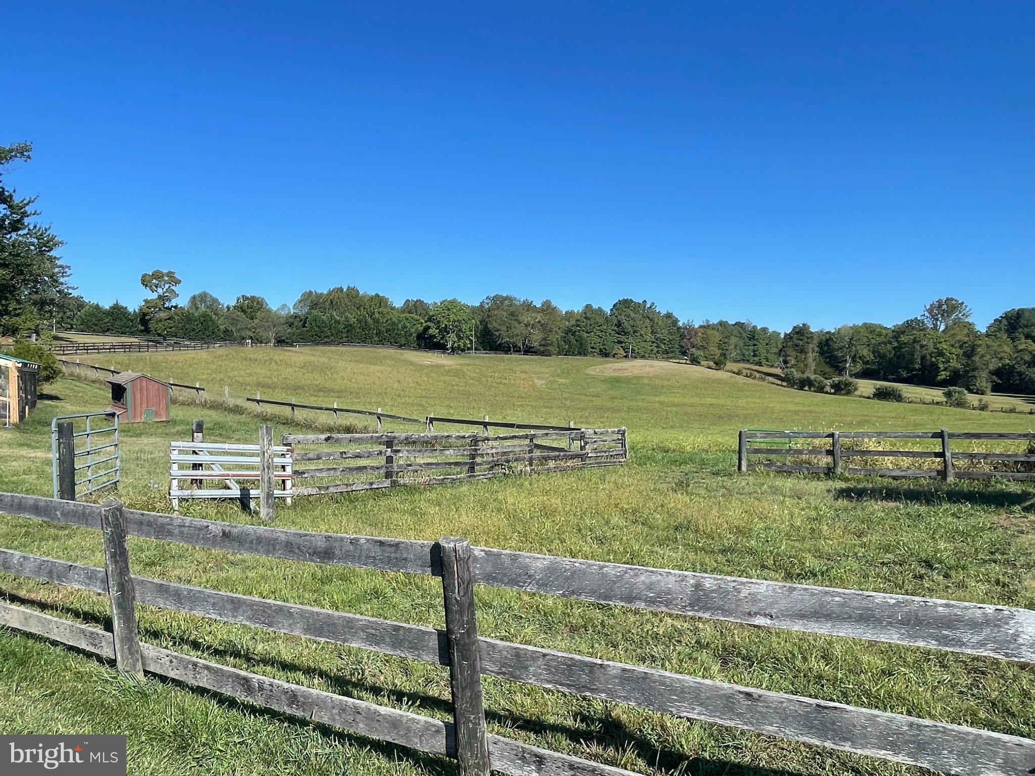 7747 Riverside Farm Road Marshall, VA 20115 - Photo 54 of 69 Serene countryside with rustic fencing.