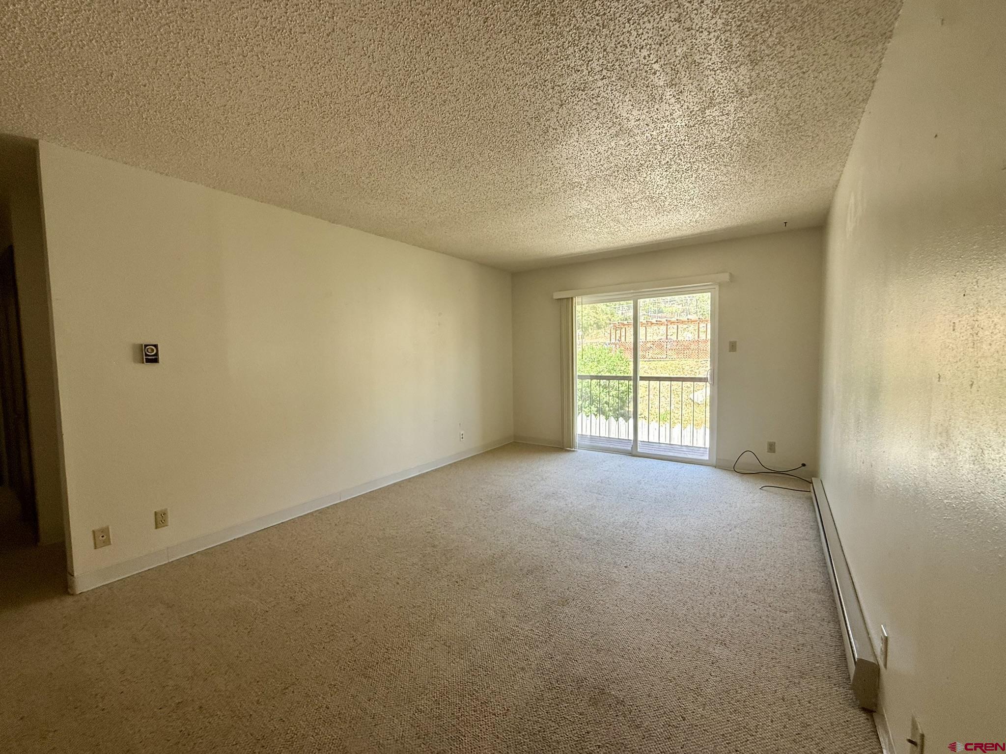 34237 Highway 550, Unit 27 Durango, CO 81301 - Photo 10 of 45 a view of a big room with windows and chandelier fan