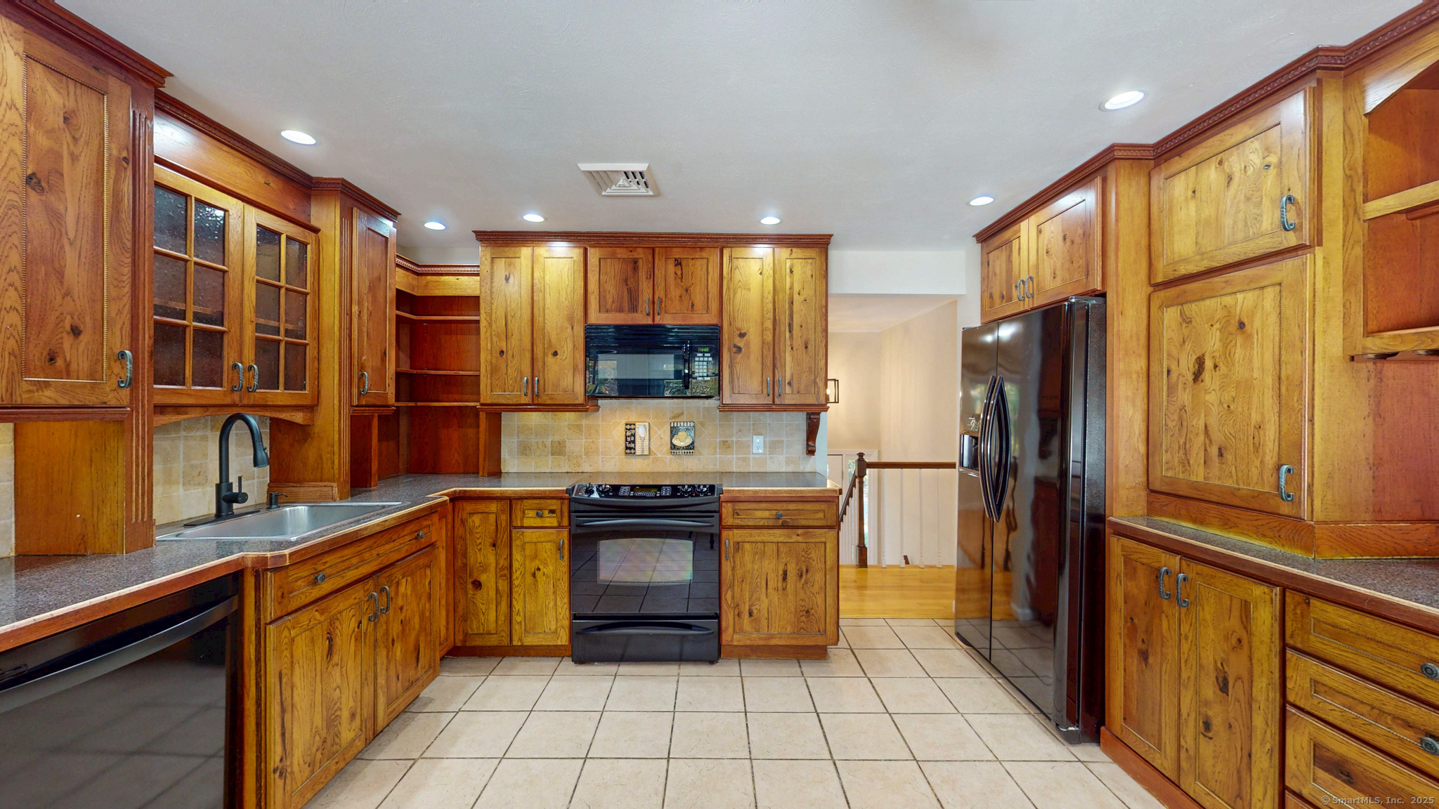 9 Old Farms Road Madison, CT 06443 - Photo 11 of 36 a large kitchen with stainless steel appliances a refrigerator and a stove top oven