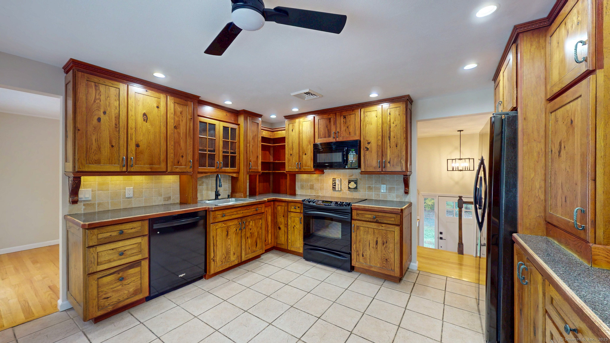 9 Old Farms Road Madison, CT 06443 - Photo 12 of 36 a kitchen with stainless steel appliances granite countertop a sink and cabinets
