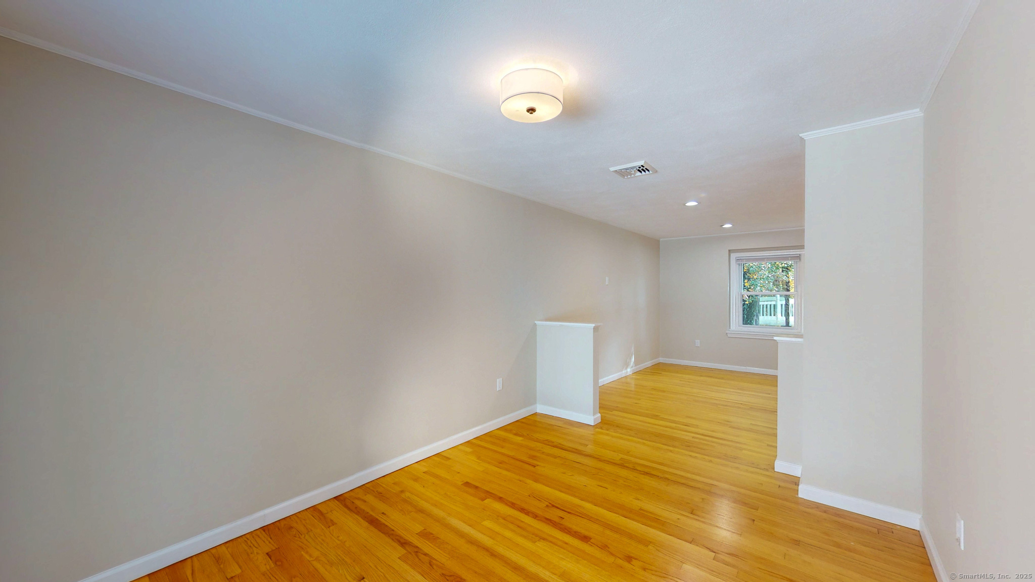 9 Old Farms Road Madison, CT 06443 - Photo 9 of 36 a view of empty room with wooden floor