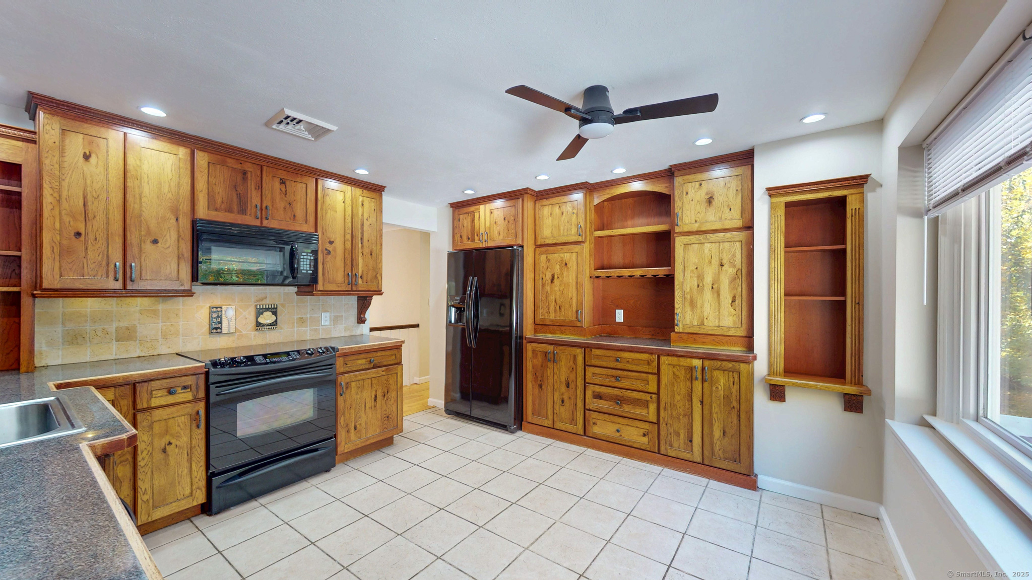 9 Old Farms Road Madison, CT 06443 - Photo 10 of 36 a kitchen with stainless steel appliances granite countertop a refrigerator and a stove top oven