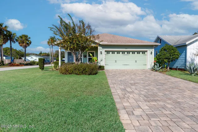 a front view of house with yard and green space
