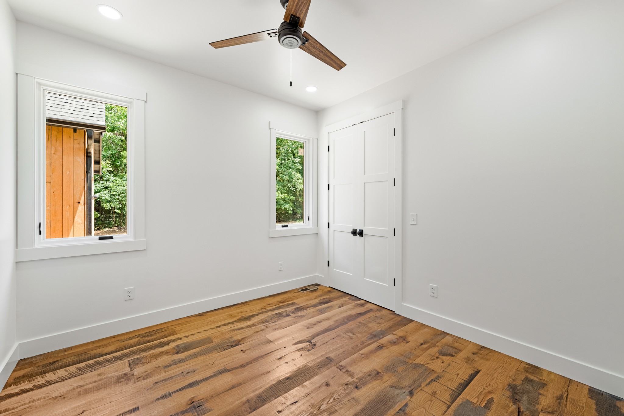 5118 Will Brown Road Spring Hill, TN 37174 - Photo 22 of 41 a view of empty room with wooden floor and fan