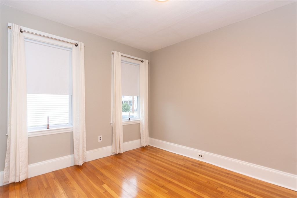 39 Gould Street, Unit A Wakefield, MA 01880 - Photo 16 of 32 a view of empty room with wooden floor