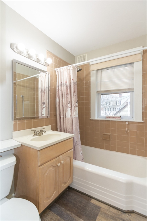 39 Gould Street, Unit A Wakefield, MA 01880 - Photo 20 of 32 a bathroom with a sink toilet tub and shower