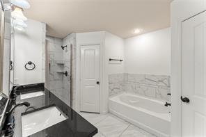 238 Rudder Road Gun Barrel City, TX 75156 - Photo 17 of 27 a bathroom with a bathtub and a shower