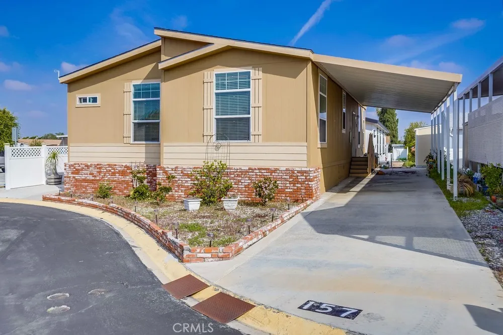 17700 Avalon, Unit 157 Carson, CA 90746 - Photo 1 of 1 a view of a house with a small yard