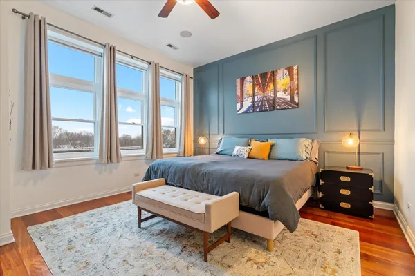 a bedroom with a bed and a couch