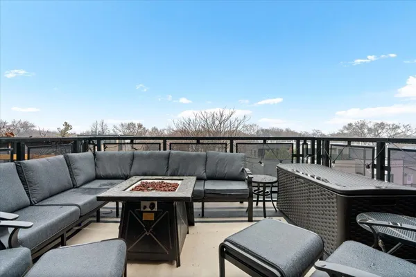 a terrace of a house with outdoor seating