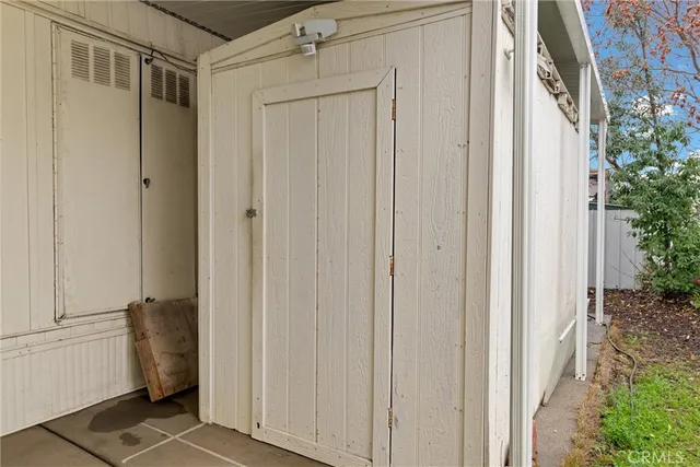 a view of a closet area with ceiling fan