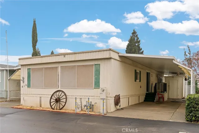a view of a car park in front of house