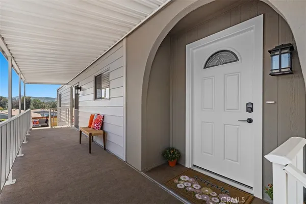 a view of front door with outdoor seating