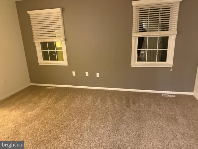 a white toilet sitting next to a sink