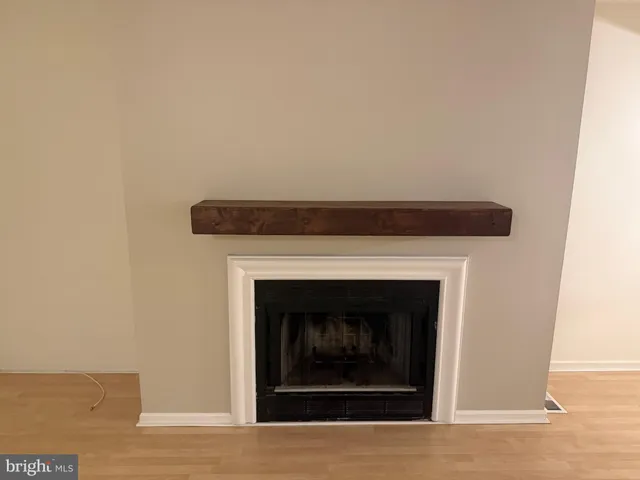 a close view of a fireplace in an empty room