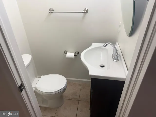 a bathroom with a toilet and a sink
