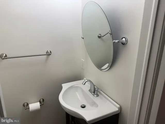 a bathroom with a sink and mirror
