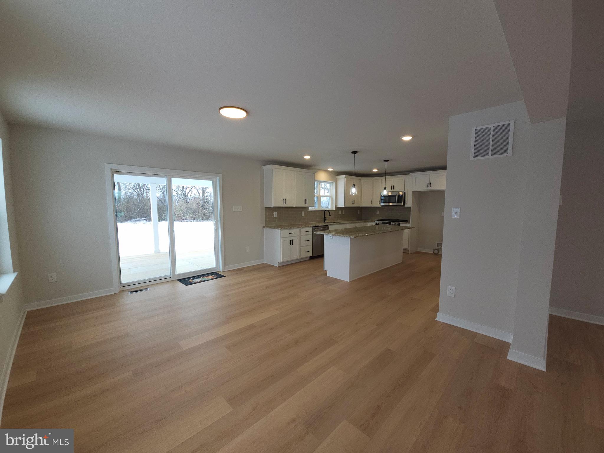 10 Fieldstone Court Bridgeton, NJ 08302 - Photo 11 of 31 a kitchen with stainless steel appliances granite countertop a refrigerator and a stove top oven