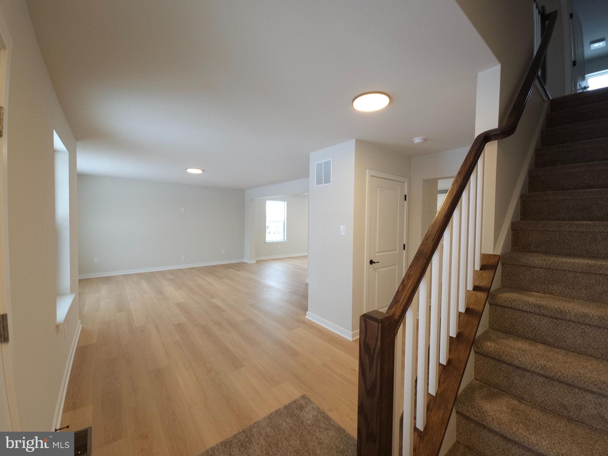 10 Fieldstone Court Bridgeton, NJ 08302 - Photo 13 of 31 an entryway in a hall with wooden floor and stairs