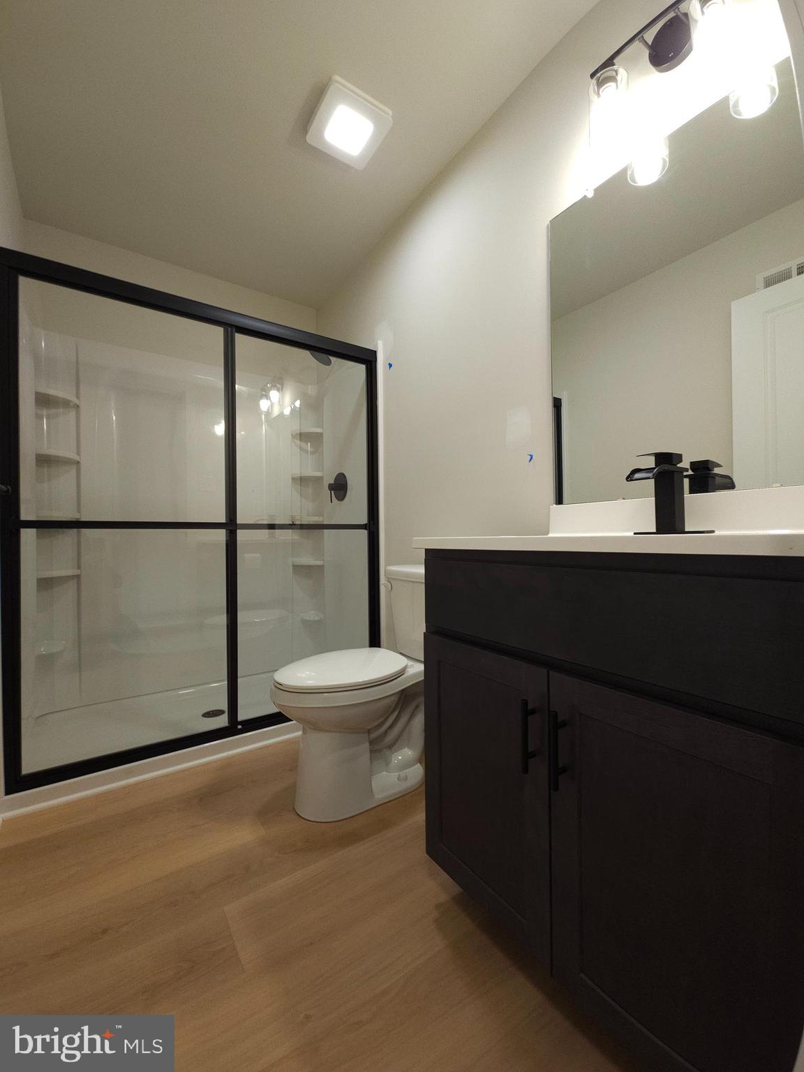 10 Fieldstone Court Bridgeton, NJ 08302 - Photo 16 of 31 a bathroom with a sink a toilet and mirror