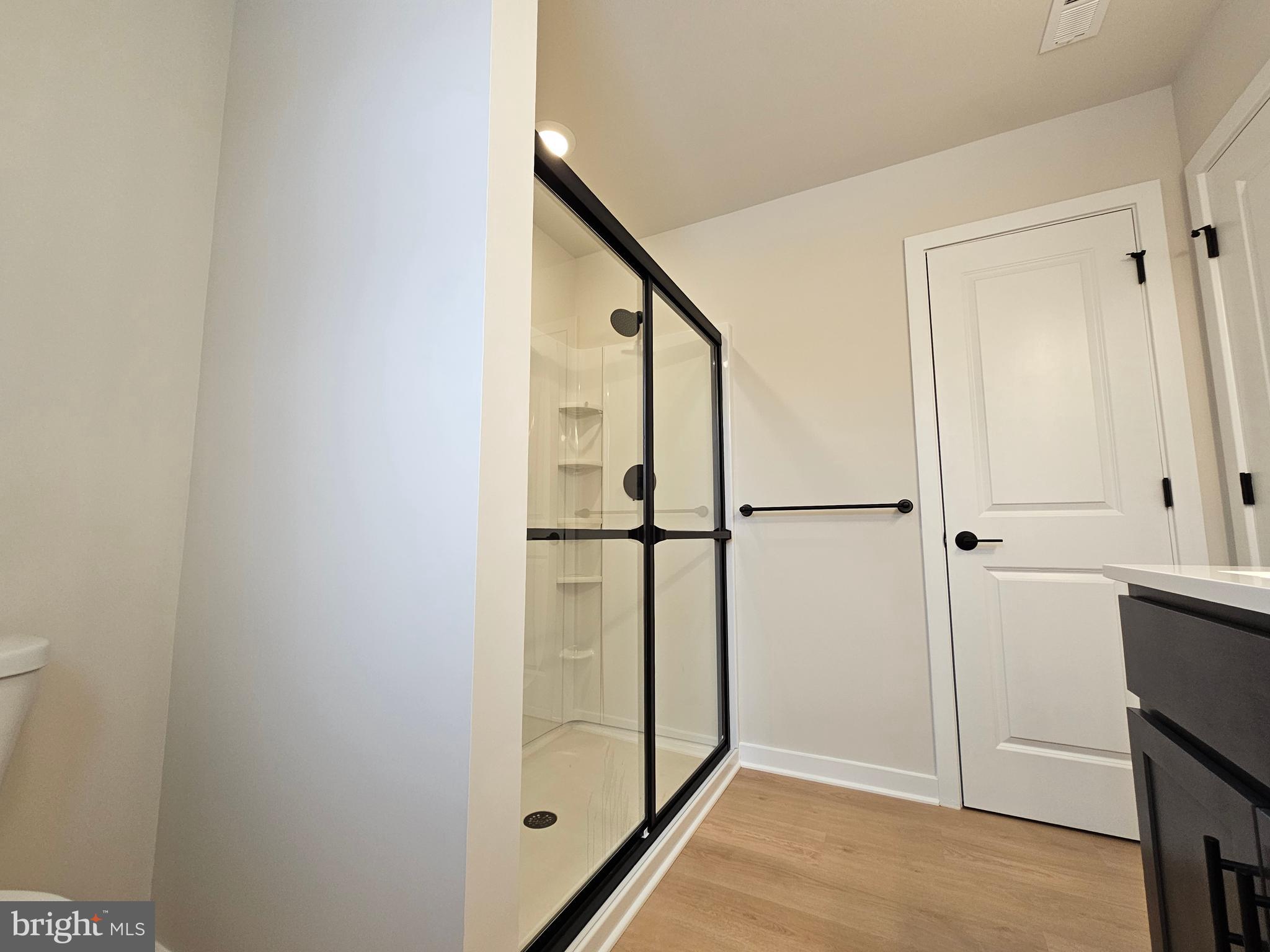 10 Fieldstone Court Bridgeton, NJ 08302 - Photo 26 of 31 a view of a hallway with wooden floor and staircase