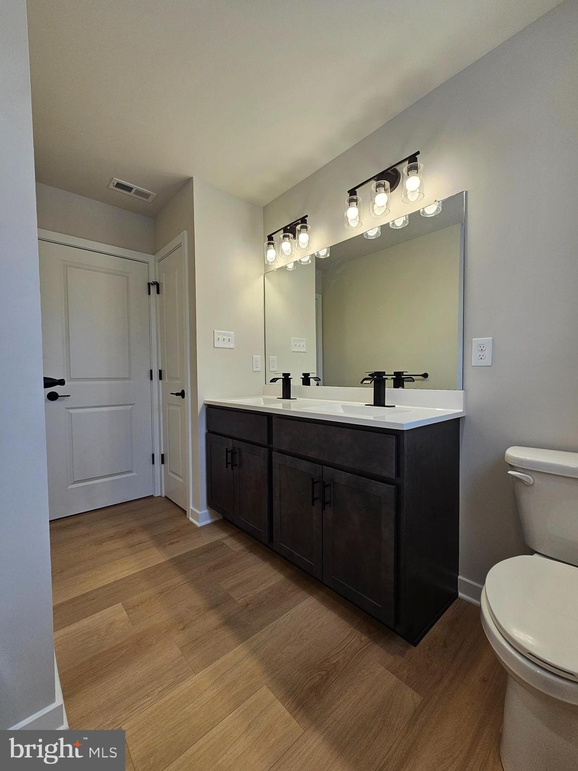 10 Fieldstone Court Bridgeton, NJ 08302 - Photo 27 of 31 a bathroom with a sink vanity mirror and toilet