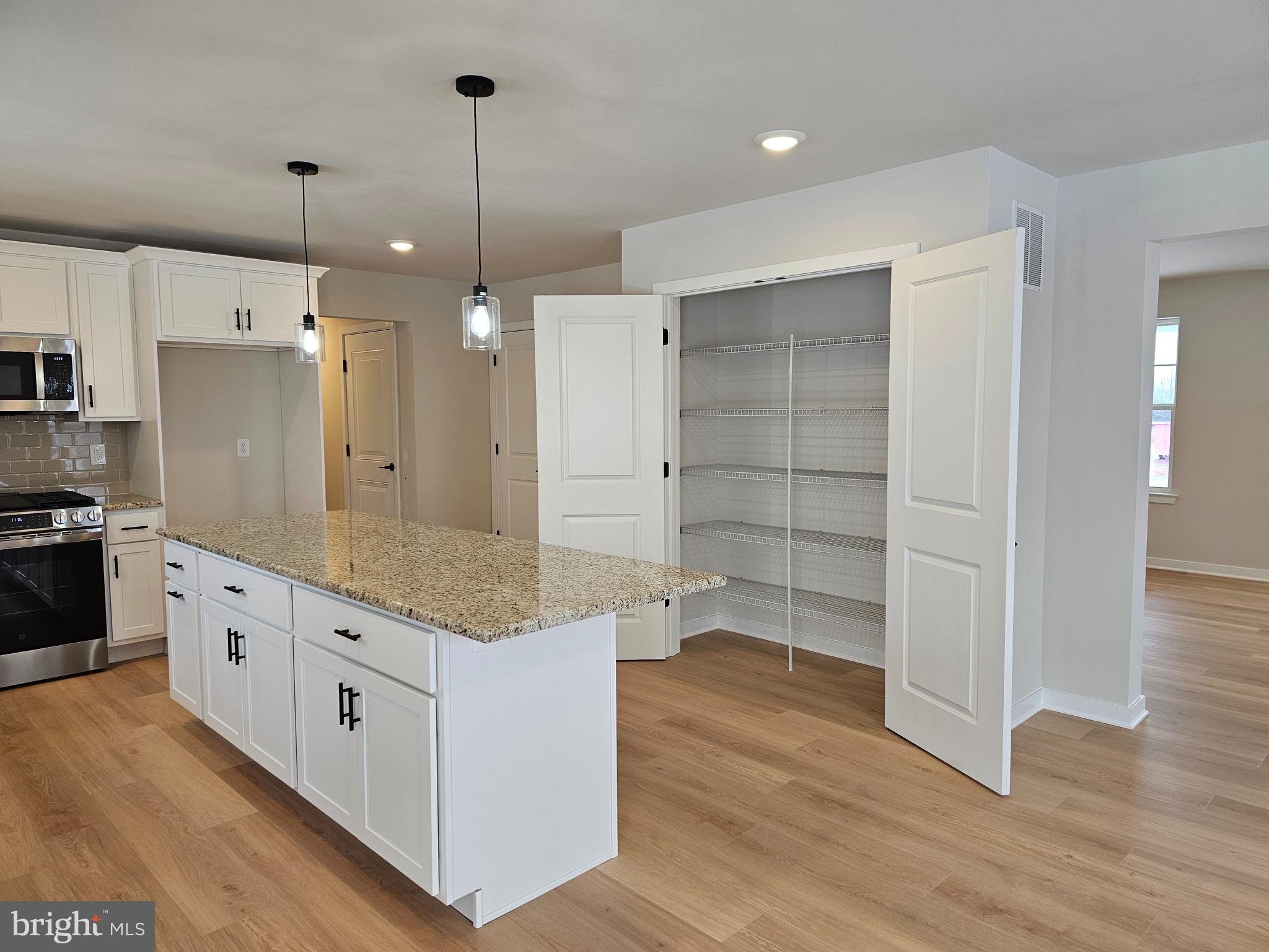 10 Fieldstone Court Bridgeton, NJ 08302 - Photo 6 of 31 a kitchen with stainless steel appliances granite countertop a refrigerator a sink and a stove