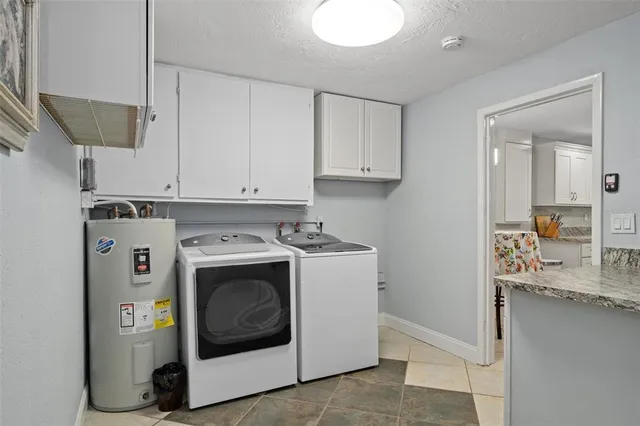 a utility room with washer and dryer