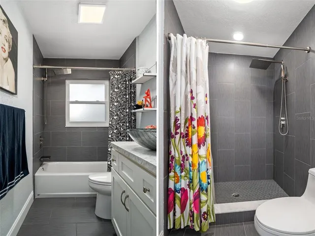 a bathroom with a toilet a sink and bathtub