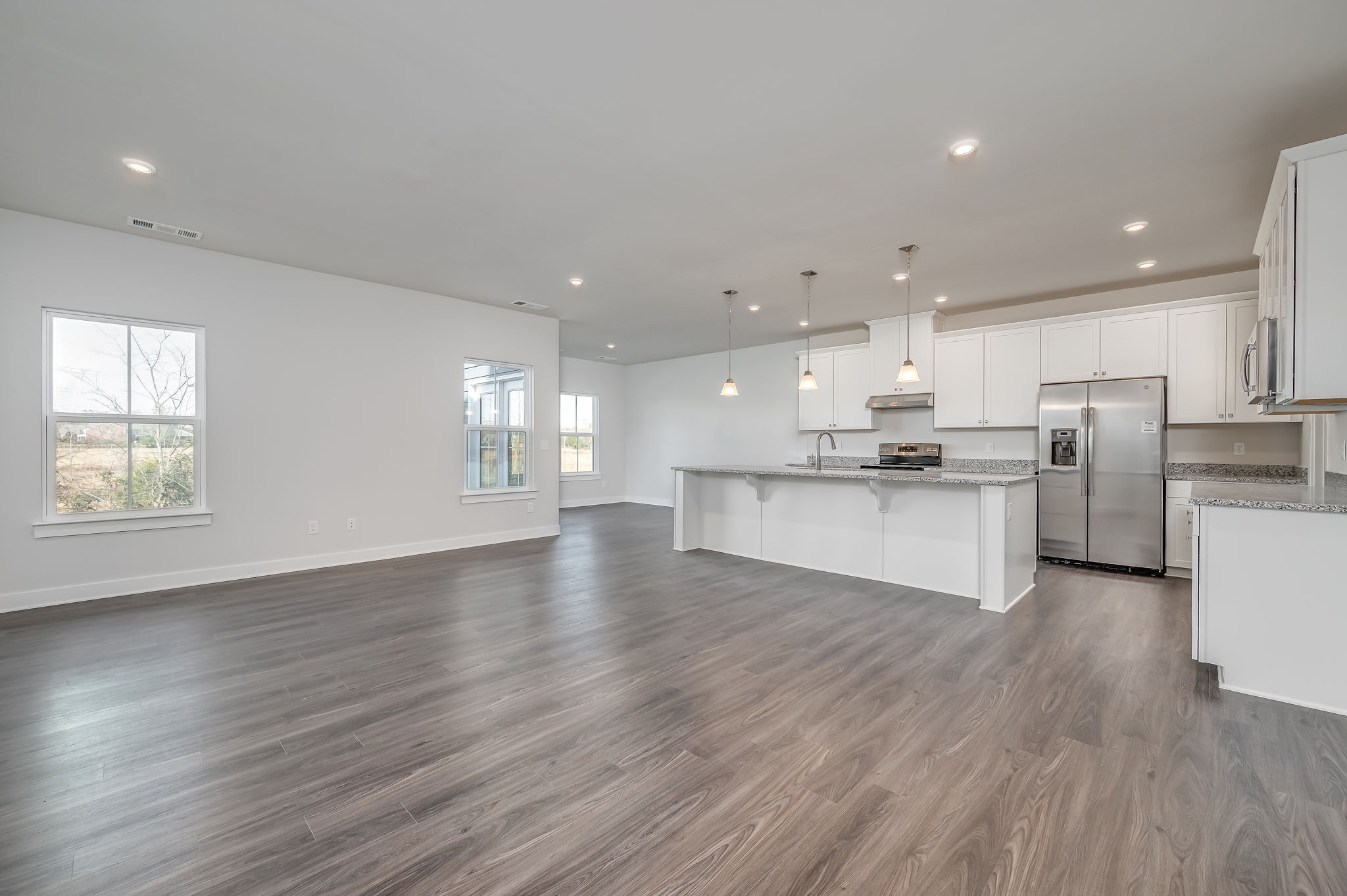 9016 Nestling Ridge College Grove, TN 37046 - Photo 19 of 30 a view of kitchen with wooden floor and window