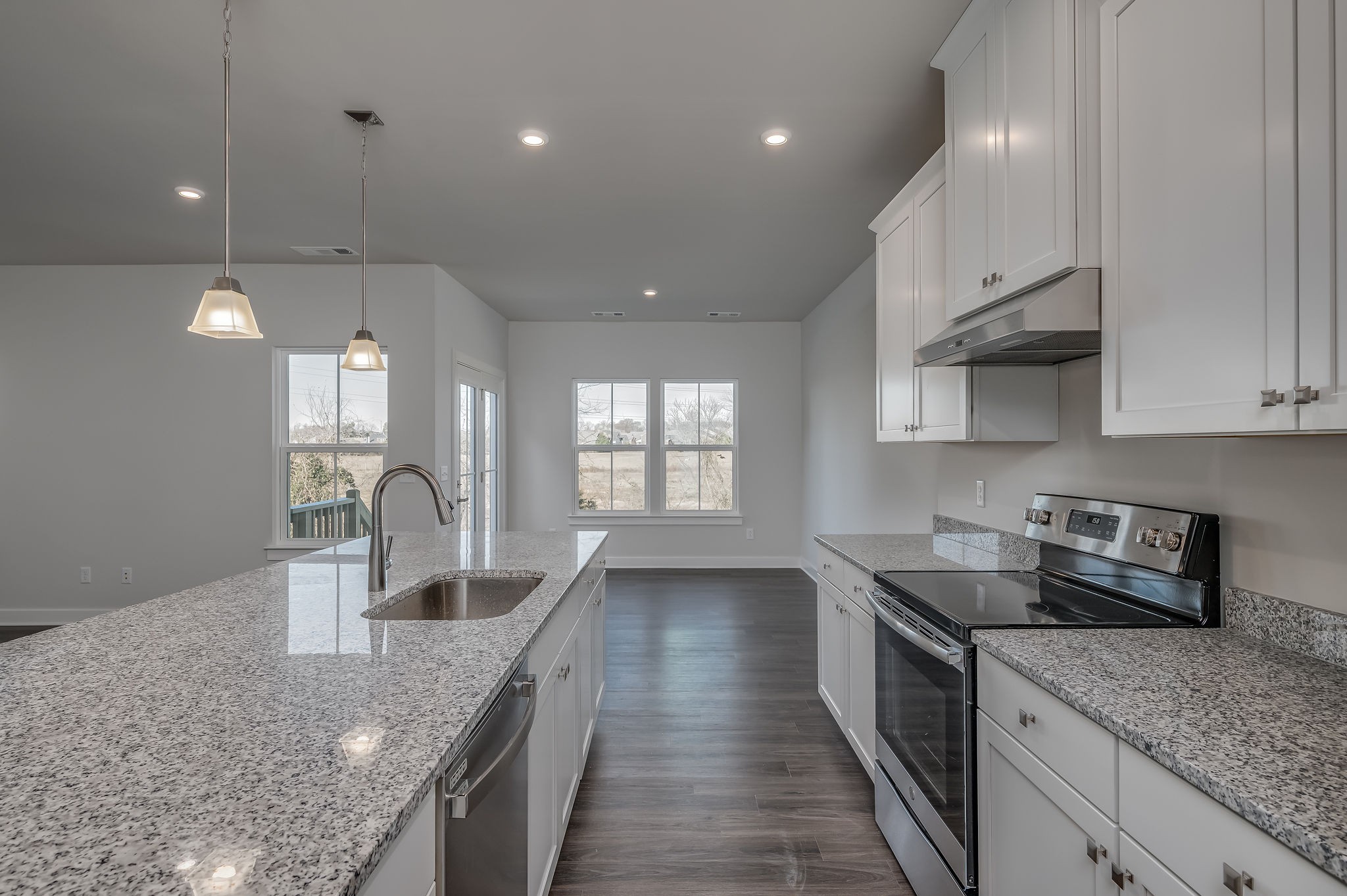 9016 Nestling Ridge College Grove, TN 37046 - Photo 23 of 30 a kitchen with stainless steel appliances granite countertop sink stove and refrigerator