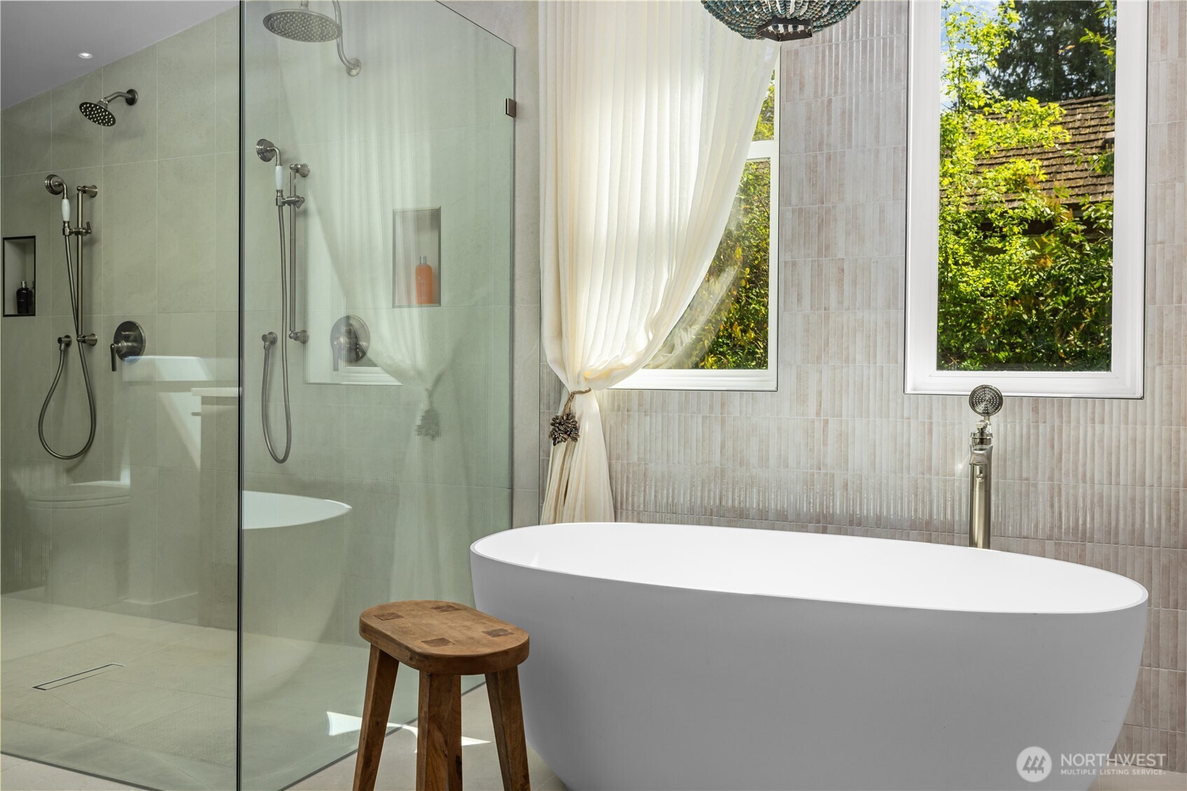 8097 West Mercer Way Mercer Island, WA 98040 - Photo 20 of 40 a bathroom with a sink a toilet and shower