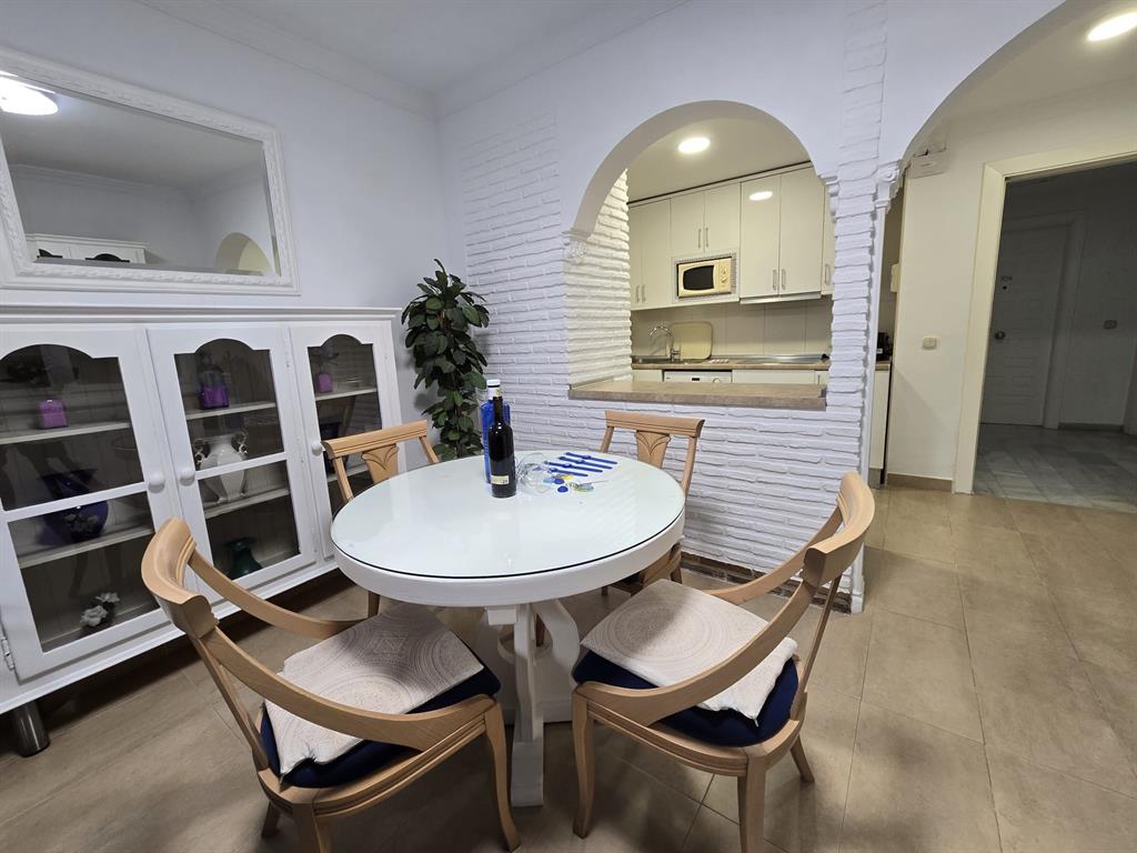 Benalmadena-malaga Av Del Parque3 Torre1 Planta7, Unit 701 Blackstock, 0 29014 - Photo 14 of 33 a backyard of a house with table and chairs