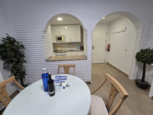 a kitchen with a sink and a stove