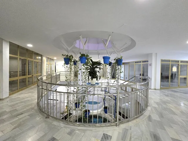a view of a dining room with furniture water and chandelier