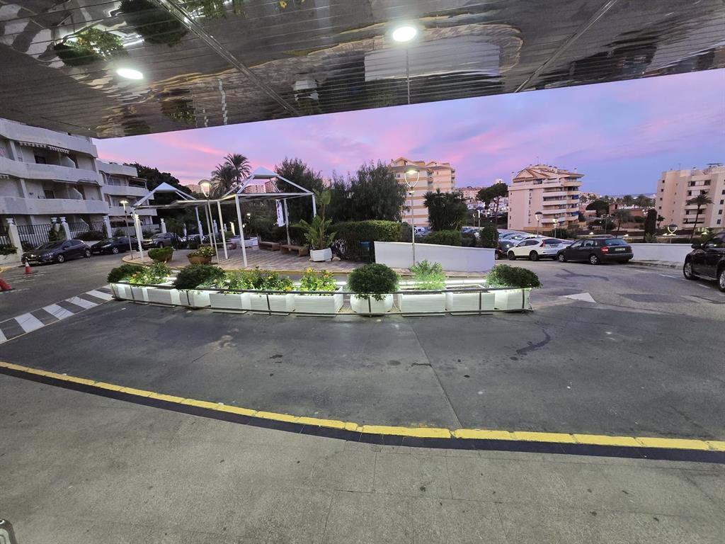 Benalmadena-malaga Av Del Parque3 Torre1 Planta7, Unit 701 Blackstock, 0 29014 - Photo 5 of 33 a view of a swimming pool with a table and chairs under an umbrella