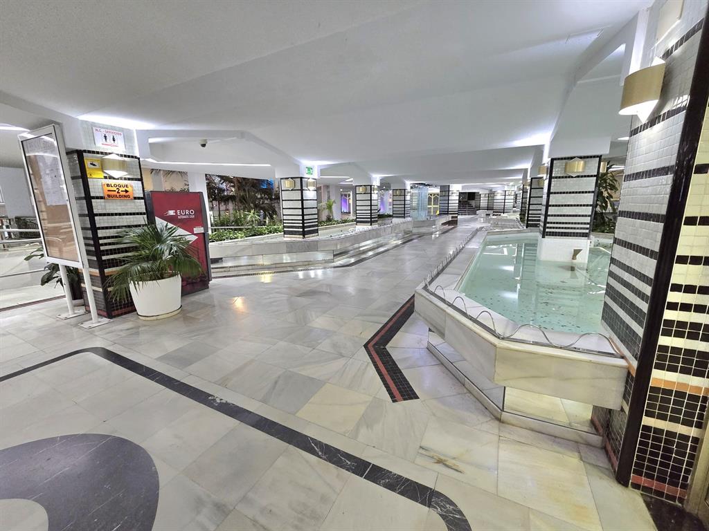 Benalmadena-malaga Av Del Parque3 Torre1 Planta7, Unit 701 Blackstock, 0 29014 - Photo 6 of 33 a living room with fireplace furniture and a rug