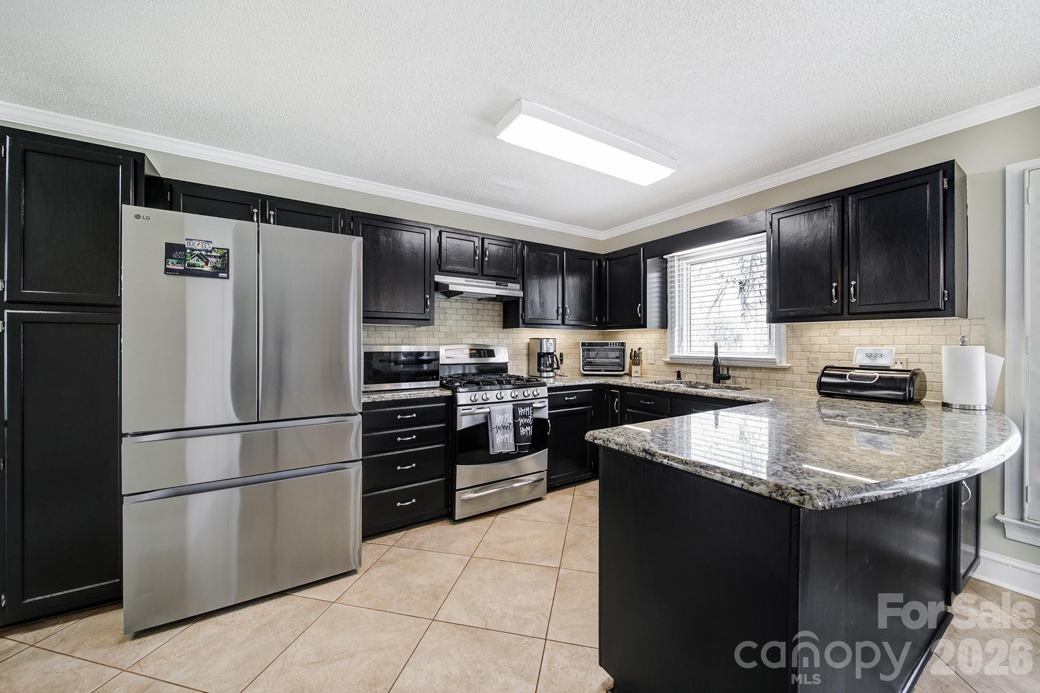 2160 Crosstrail Ridge Rock Hill, SC 29732 - Photo 12 of 37 a kitchen with a refrigerator stove and sink