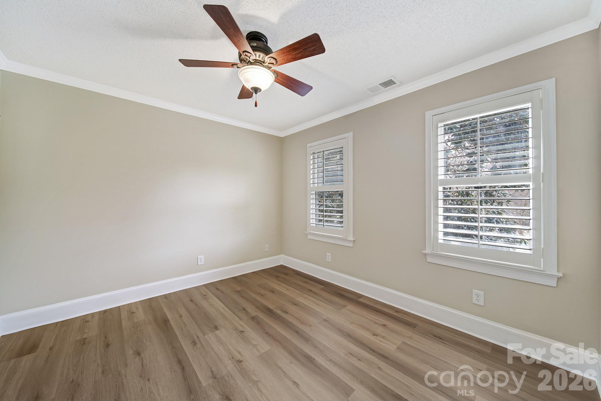 2160 Crosstrail Ridge Rock Hill, SC 29732 - Photo 16 of 37 a view of an empty room with wooden floor and a window