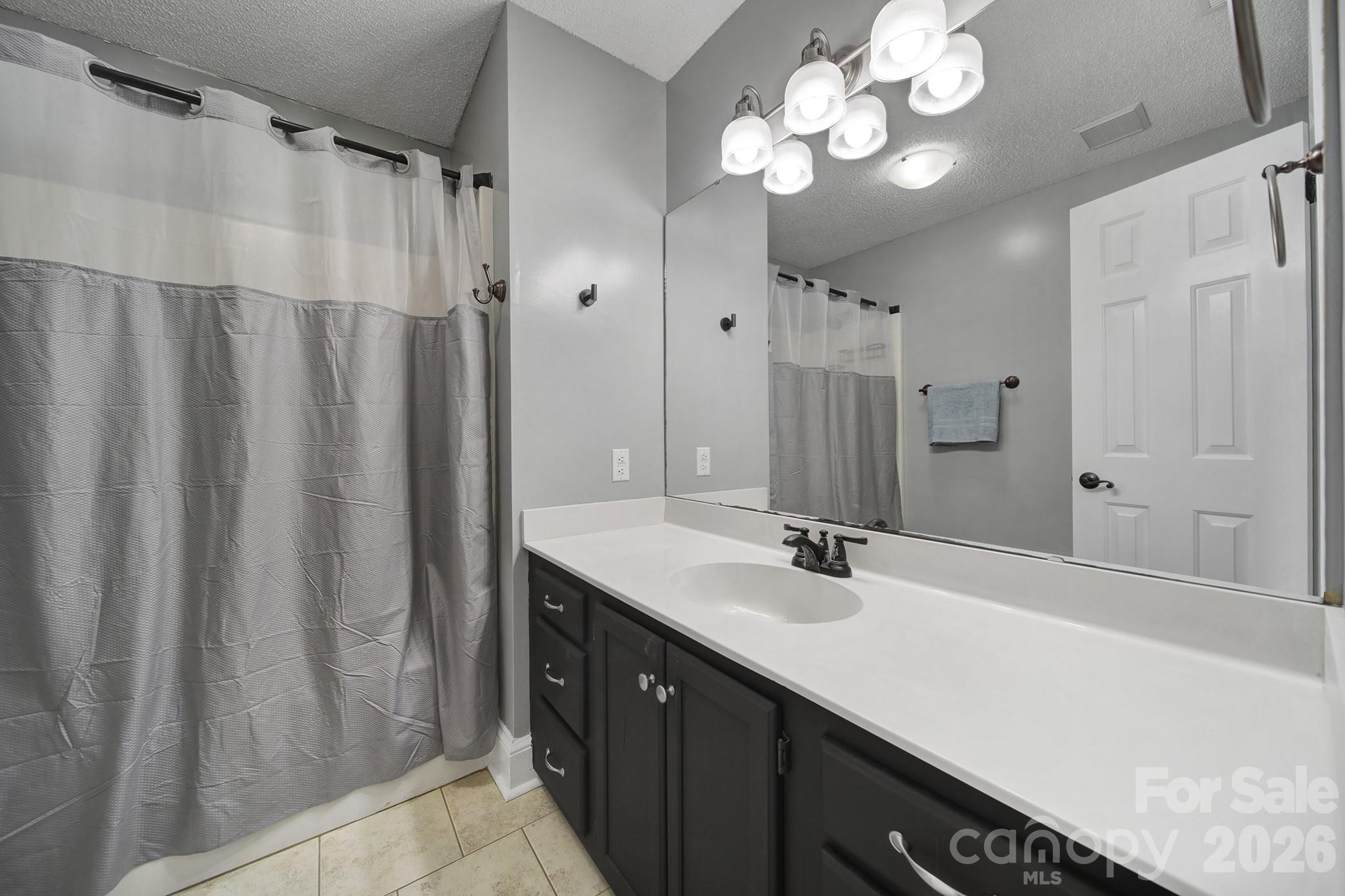 2160 Crosstrail Ridge Rock Hill, SC 29732 - Photo 20 of 37 a bathroom with a sink vanity granite and a mirror