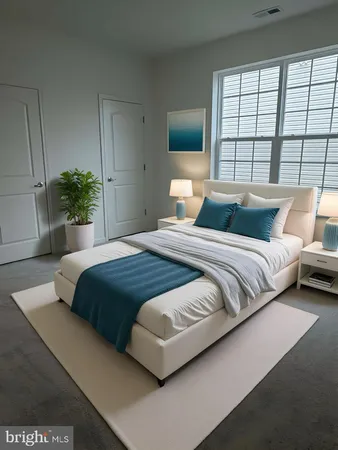 a bedroom with a large bed and a large window