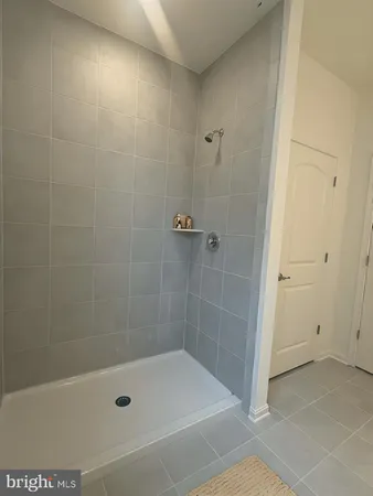 a bathroom with a shower and a bathtub