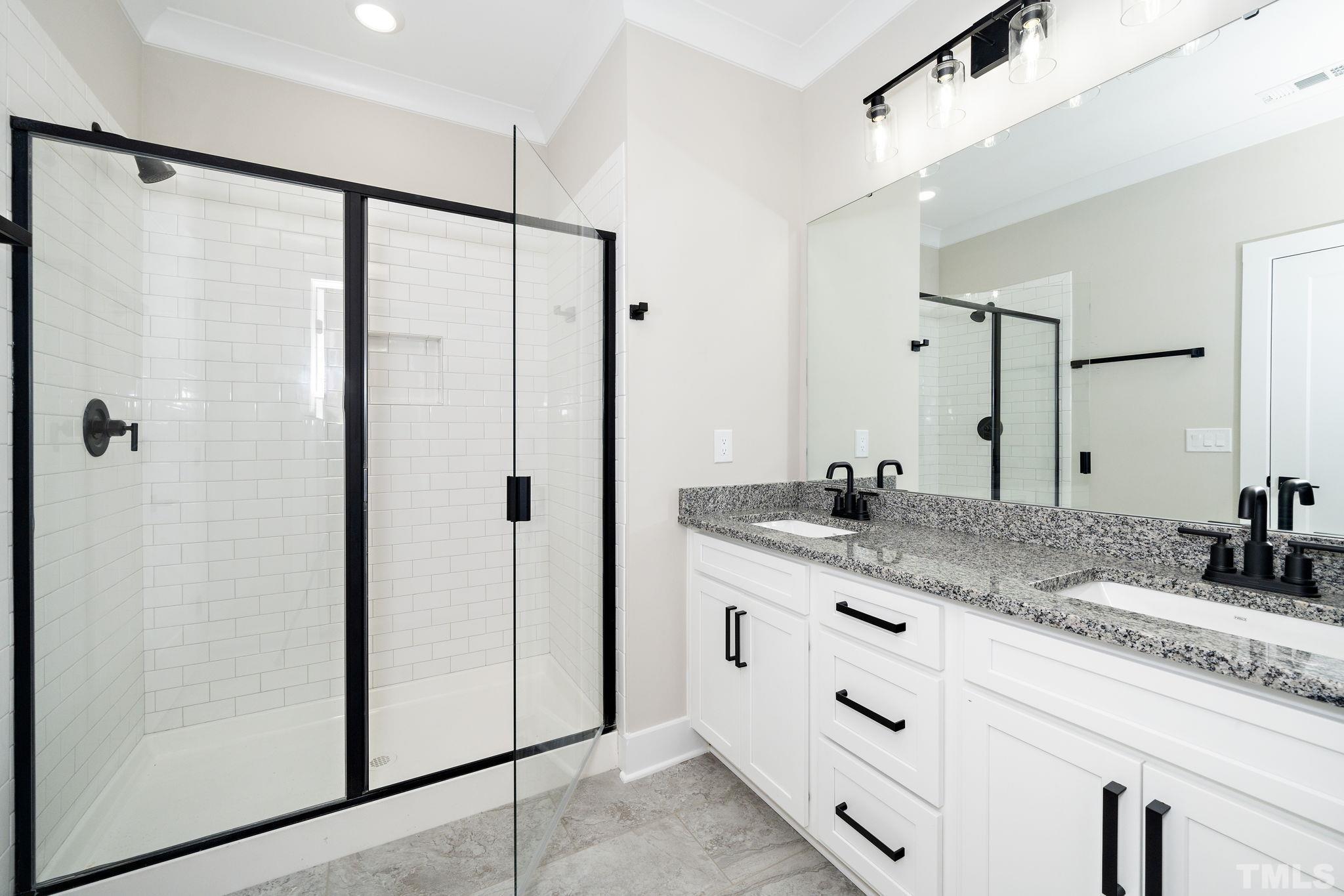 6104 Fox Raleigh, NC 27616 - Photo 22 of 54 a bathroom with a granite countertop sink mirror and double